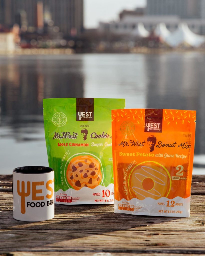 Mr. West Gluten free and Vegan baking mixes on a table overlooking the inner Harbor of Baltimore.