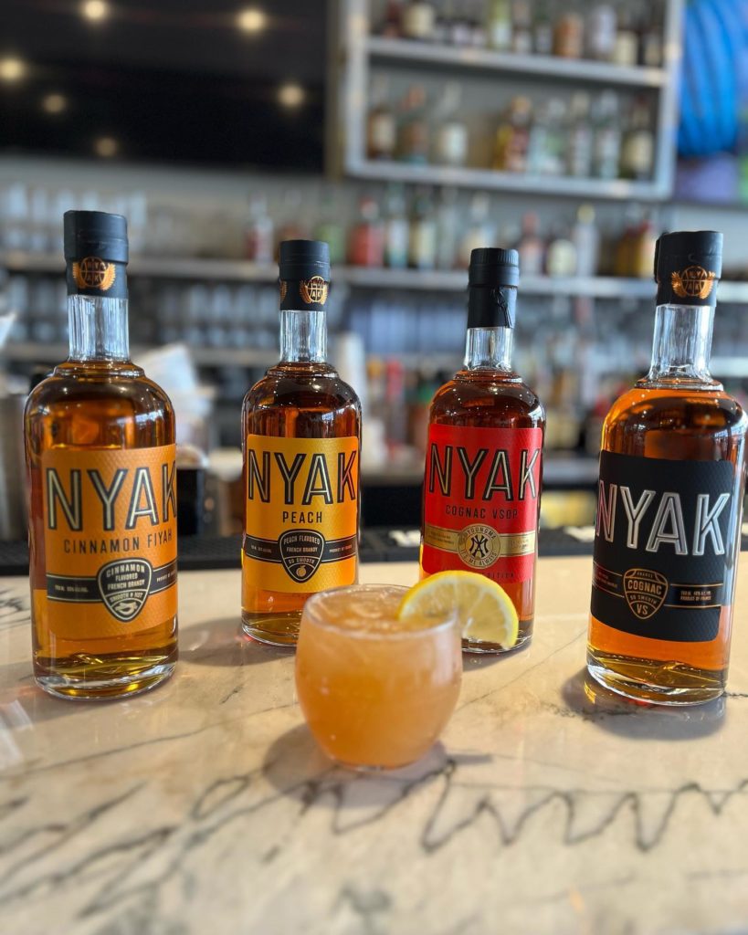 Four types of Nyak Black Owned cognac on a bar