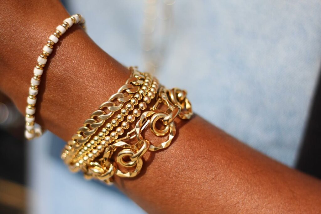 stacked gold bracelets from black owned jewelry brand 1929 Galore