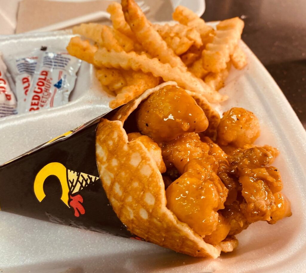 Coneheads fried chicken bites in a waffle cone with fries